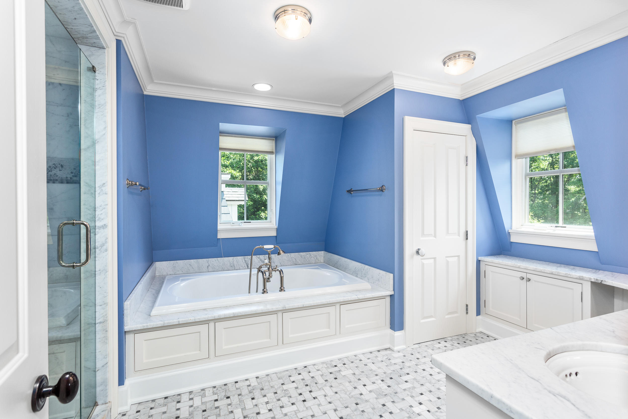 136 Pear Tree Point Road Darien, CT 06820 - Photo 27 of 56 a en suite bathroom with a tub sink and mirror