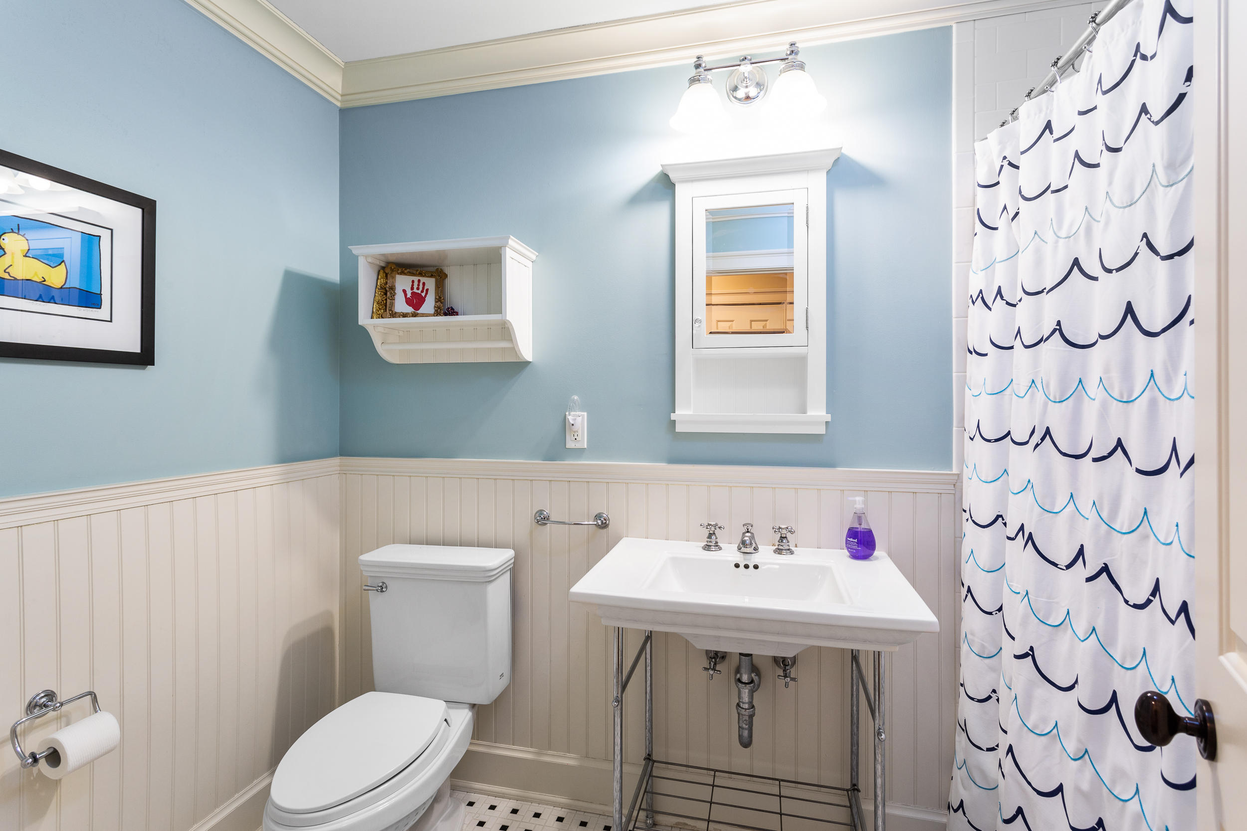 136 Pear Tree Point Road Darien, CT 06820 - Photo 32 of 56 a bathroom with a sink and a toilet