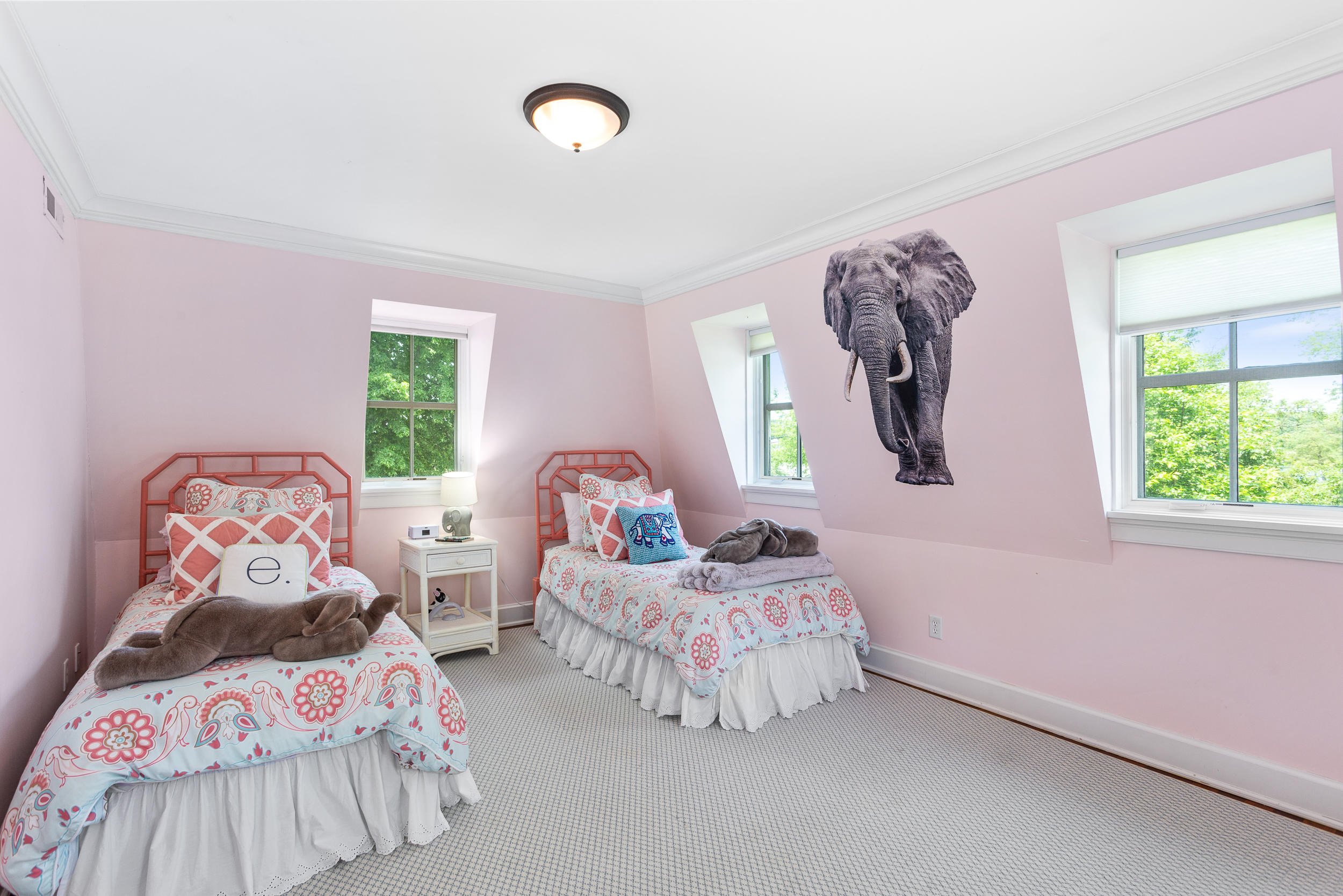 136 Pear Tree Point Road Darien, CT 06820 - Photo 34 of 56 a bedroom with two beds and a large window