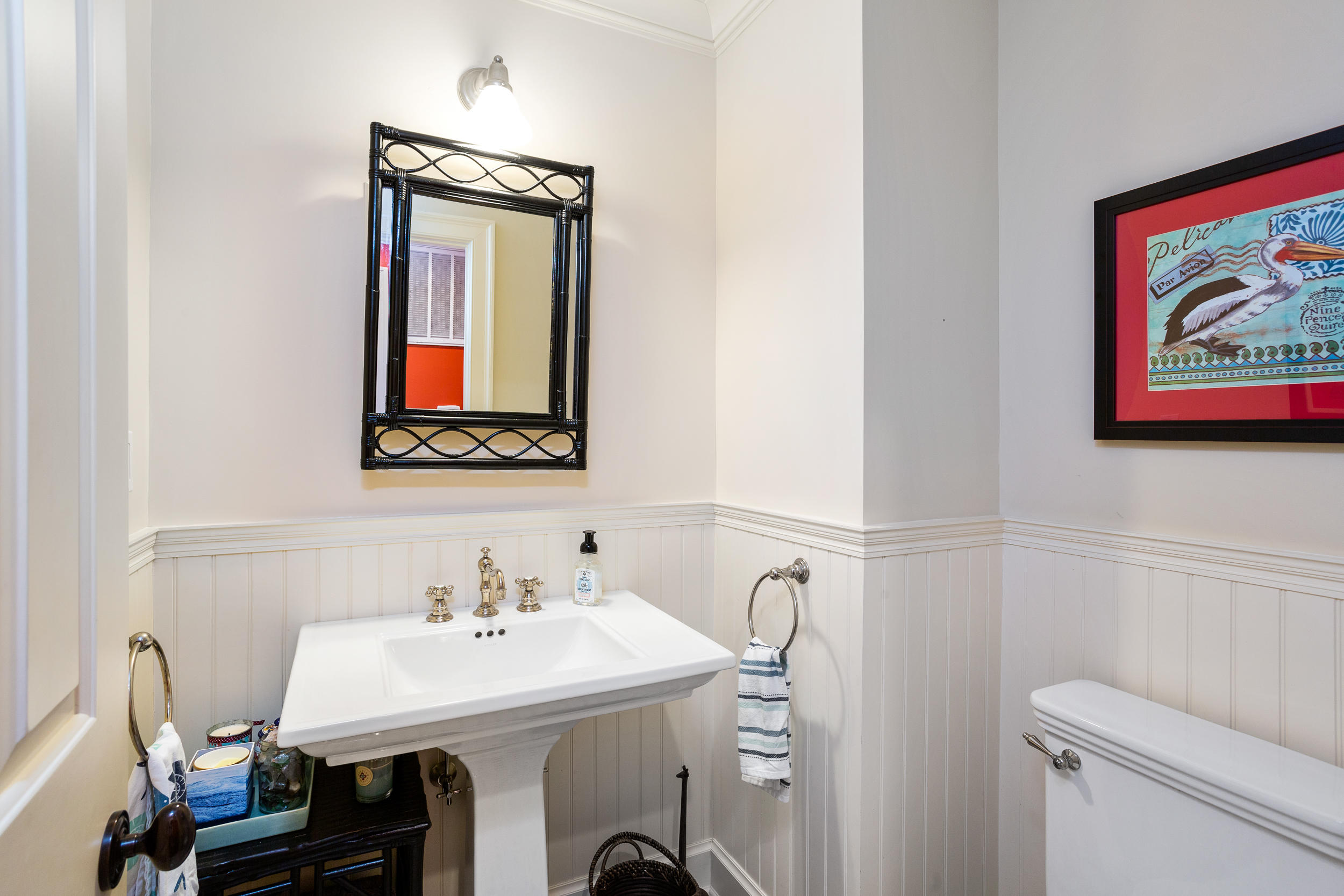 136 Pear Tree Point Road Darien, CT 06820 - Photo 35 of 56 a bathroom with a sink mirror and toilet