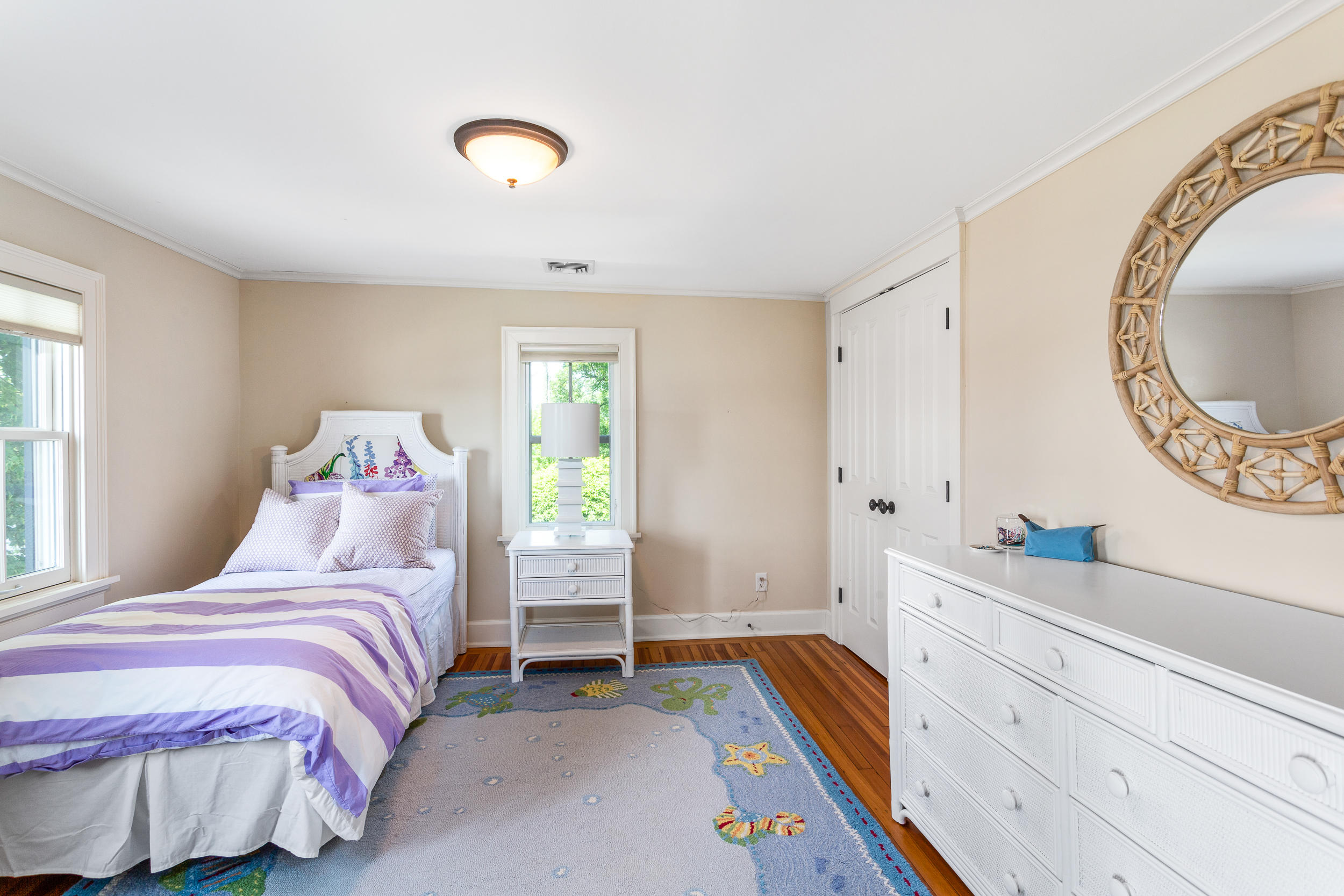 136 Pear Tree Point Road Darien, CT 06820 - Photo 36 of 56 a bedroom with a bed and a dresser