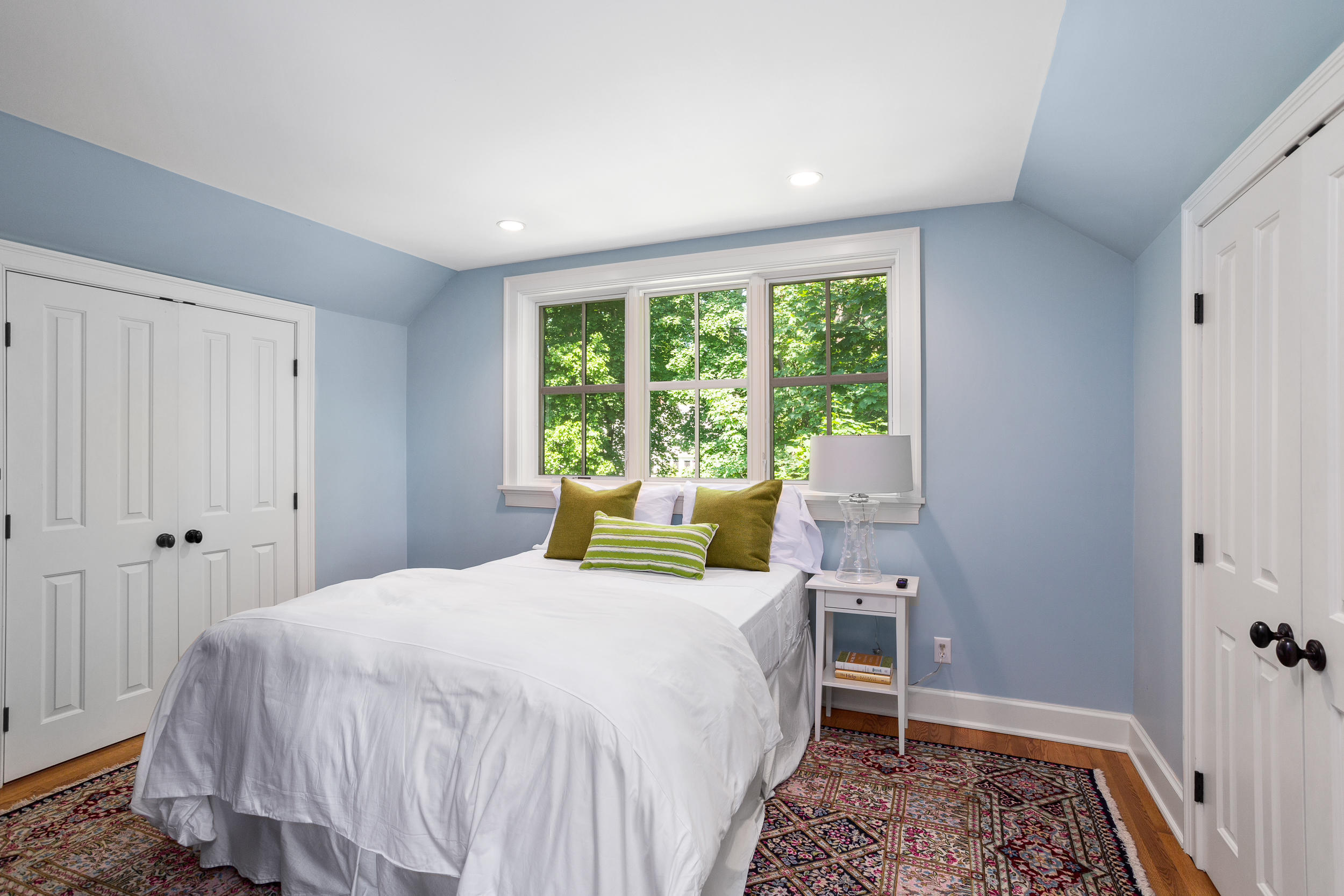 136 Pear Tree Point Road Darien, CT 06820 - Photo 37 of 56 a bedroom with a bed and a window