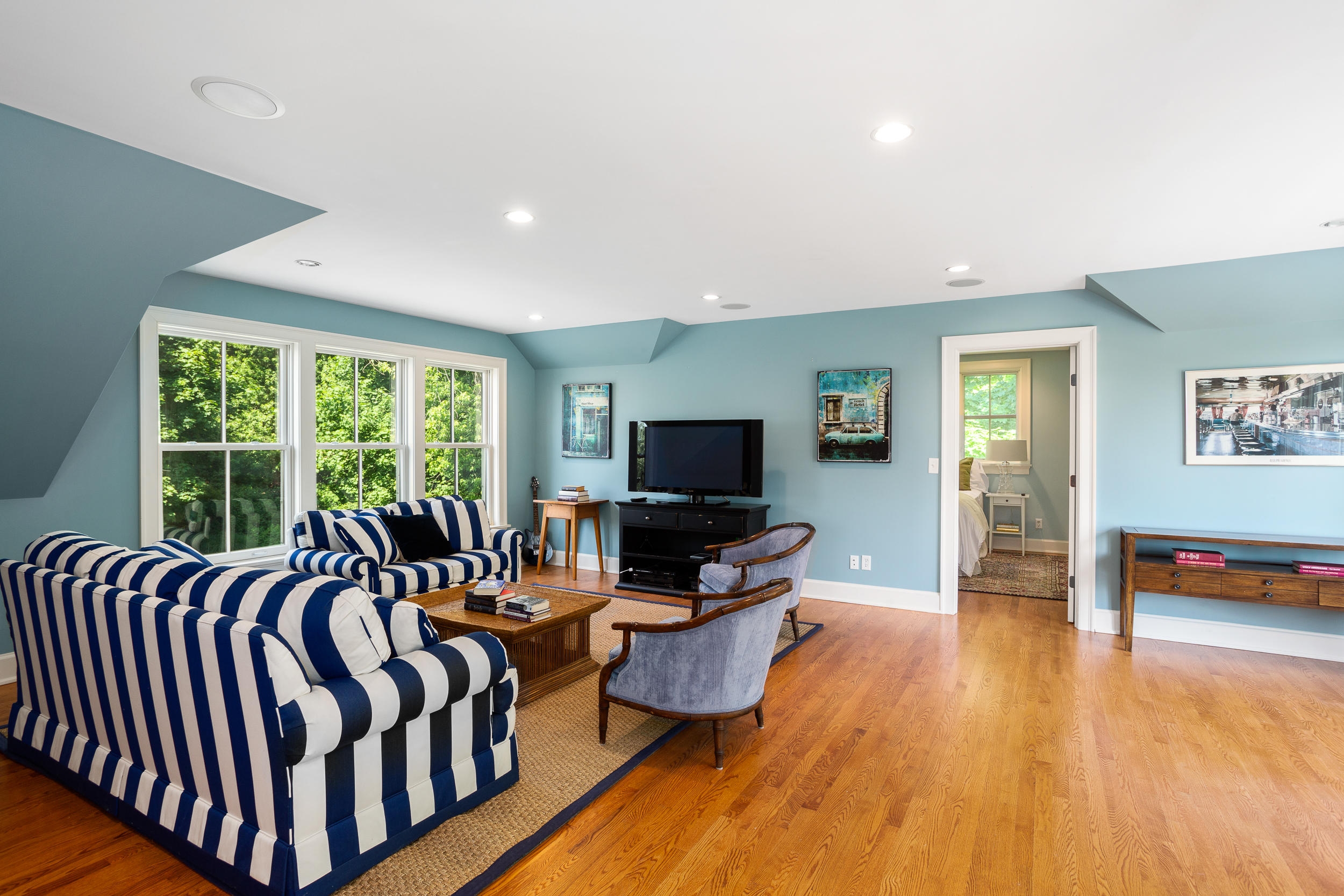 136 Pear Tree Point Road Darien, CT 06820 - Photo 38 of 56 a living room with furniture fireplace and a flat screen tv
