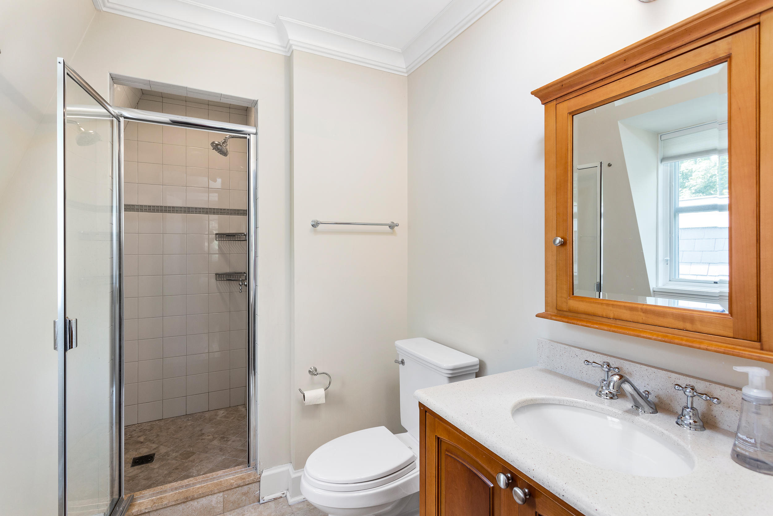 136 Pear Tree Point Road Darien, CT 06820 - Photo 40 of 56 a bathroom with a granite countertop sink toilet and shower