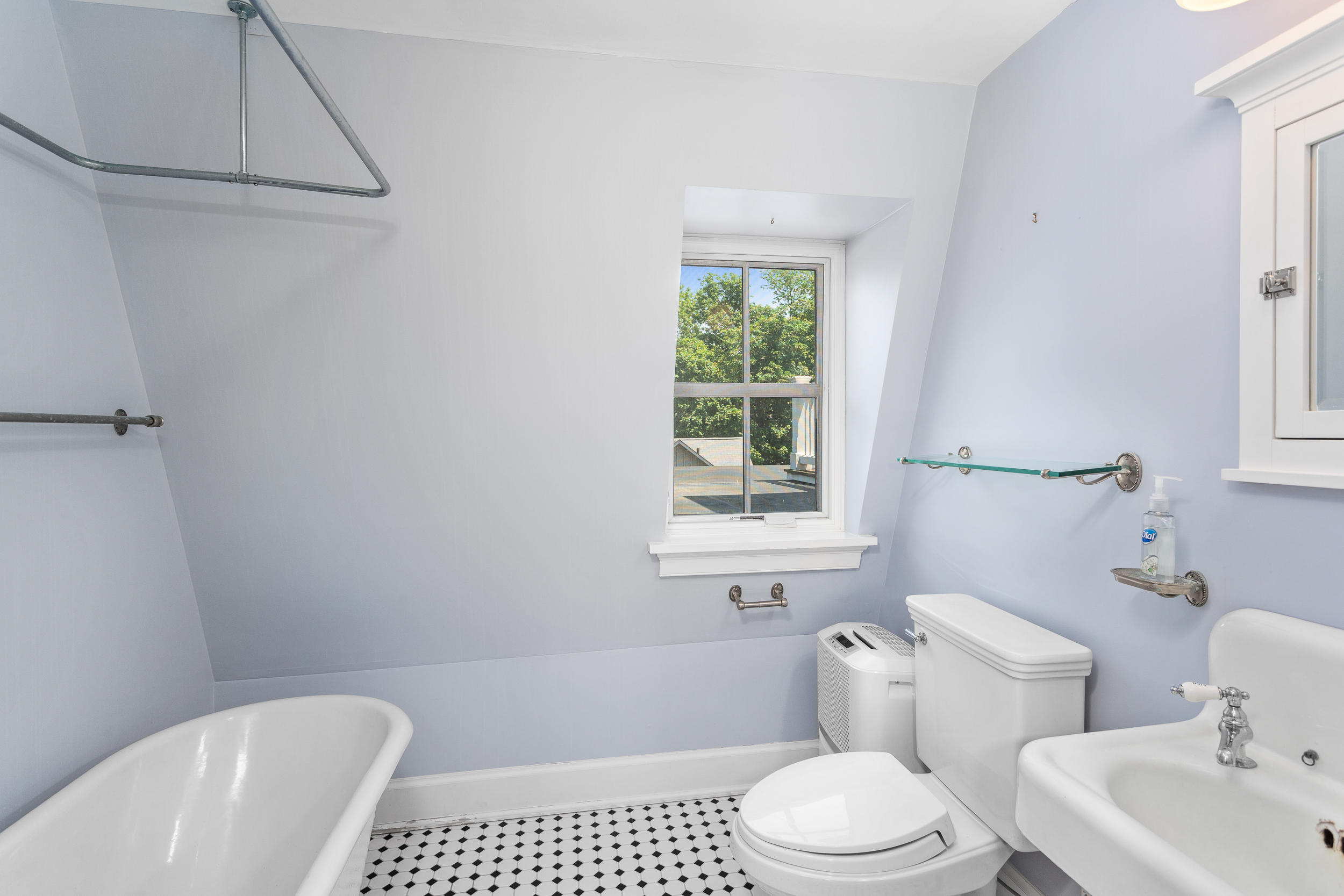 136 Pear Tree Point Road Darien, CT 06820 - Photo 42 of 56 a bath room with a toilet a sink and a bath tub