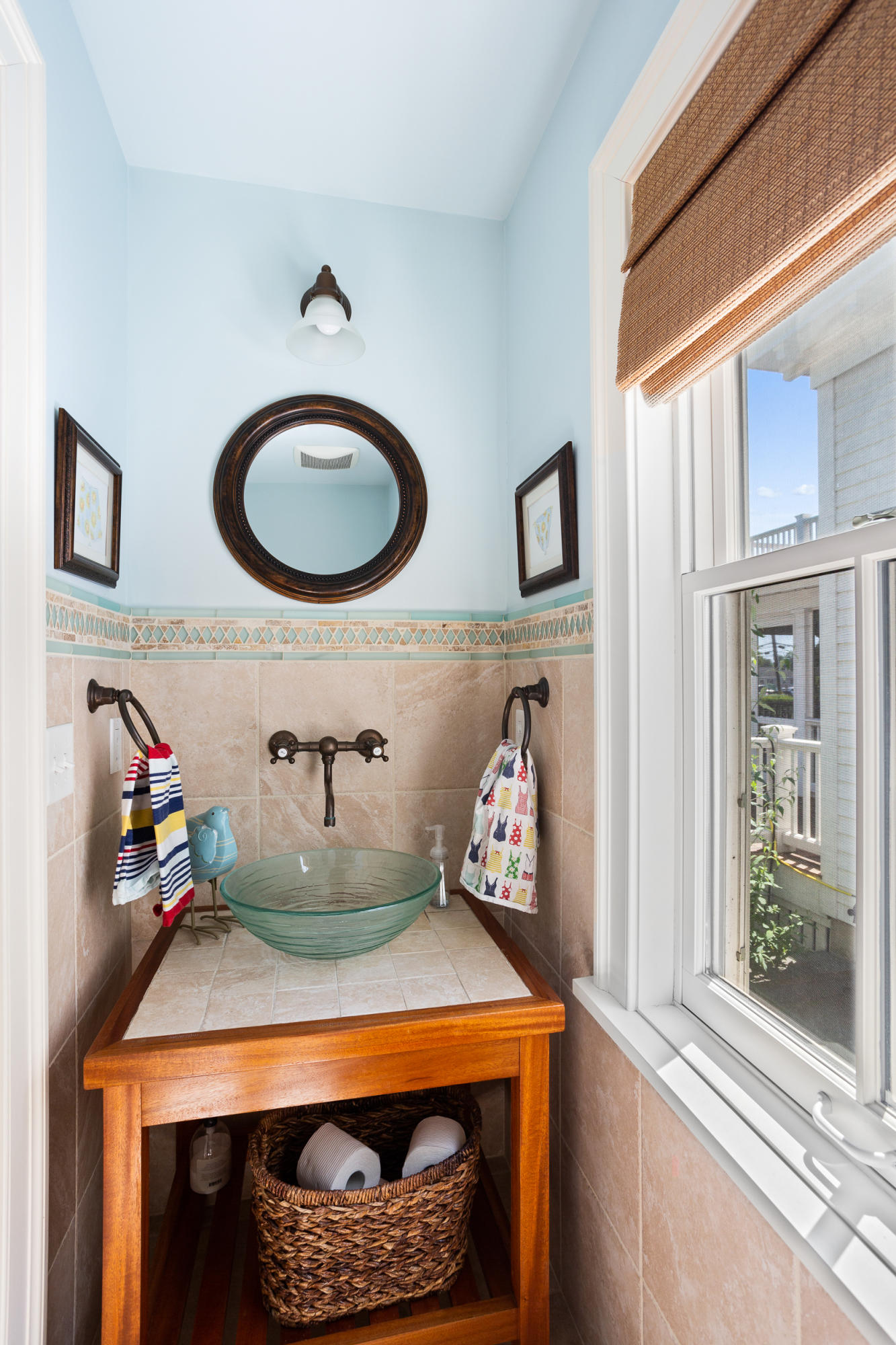 136 Pear Tree Point Road Darien, CT 06820 - Photo 46 of 56 a bathroom with a sink and a mirror