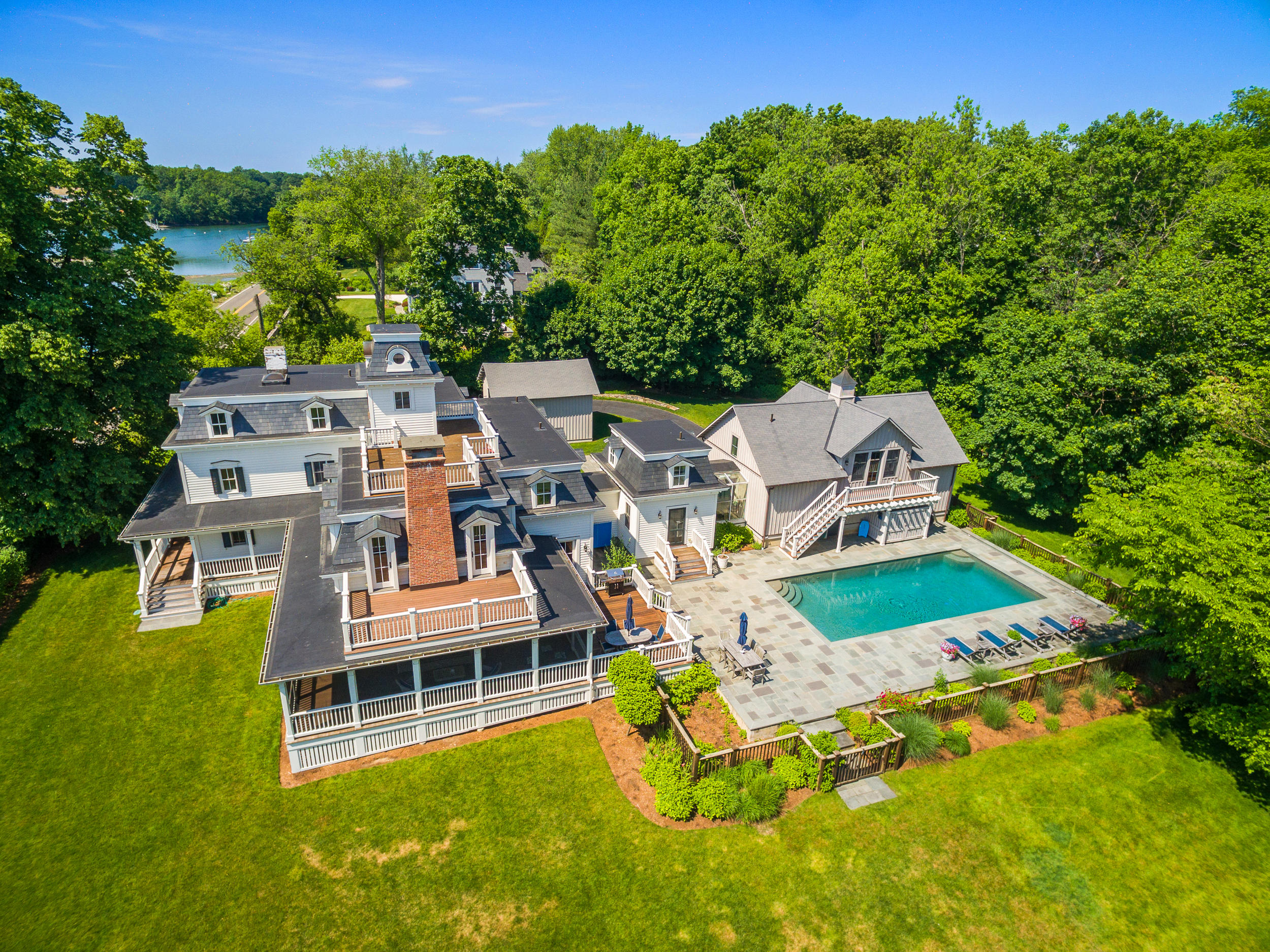 136 Pear Tree Point Road Darien, CT 06820 - Photo 53 of 56 an aerial view of a house with swimming pool garden and outdoor seating
