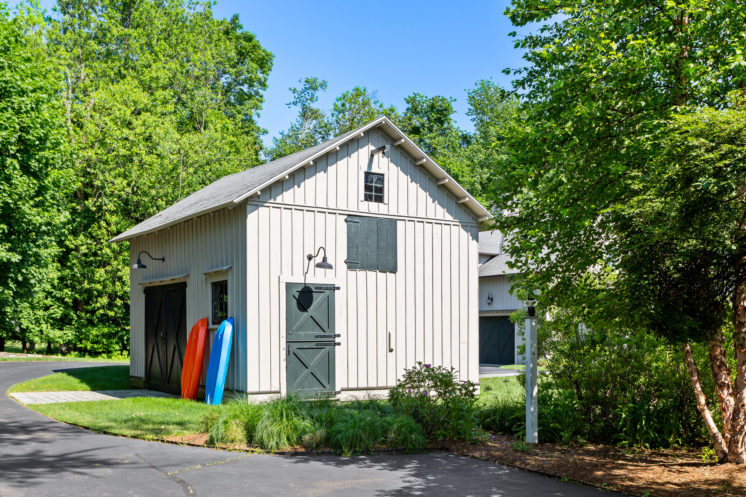 136 Pear Tree Point Road Darien, CT 06820 - Photo 9 of 56 a view of a house with a yard and large trees