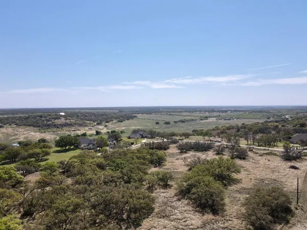 an aerial view of residential houses and city view