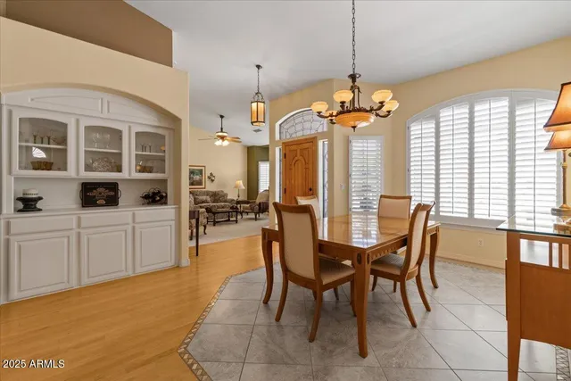 a kitchen with granite countertop a refrigerator stove and sink