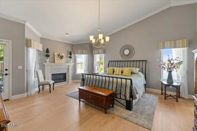 a view of a workspace with furniture and a bookshelf