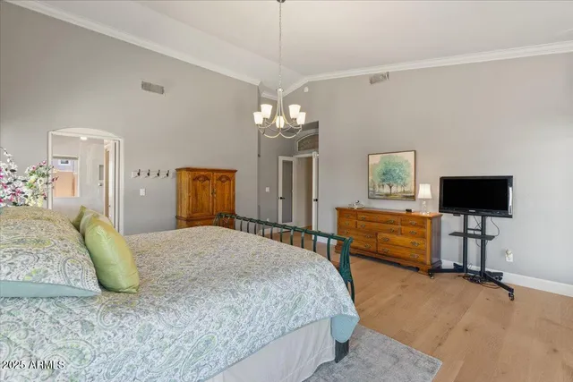 a bed room with a bed and a chair