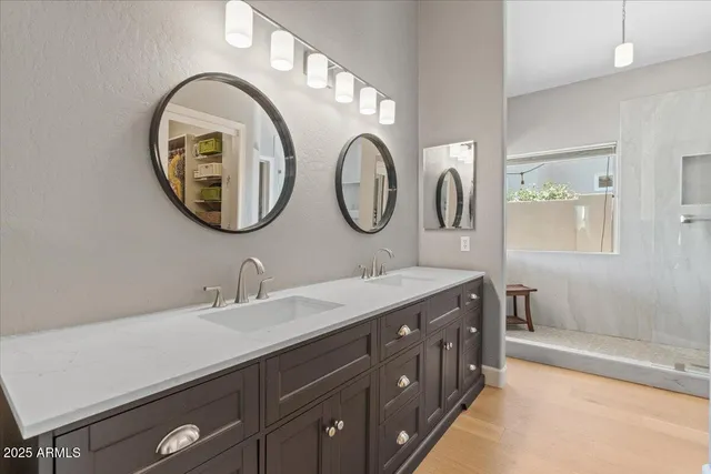 a bedroom with a balcony a bed and a chair