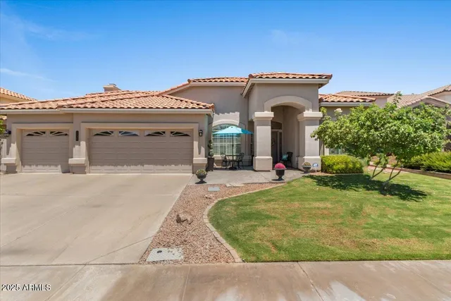 a view of a house with swimming pool and sitting area