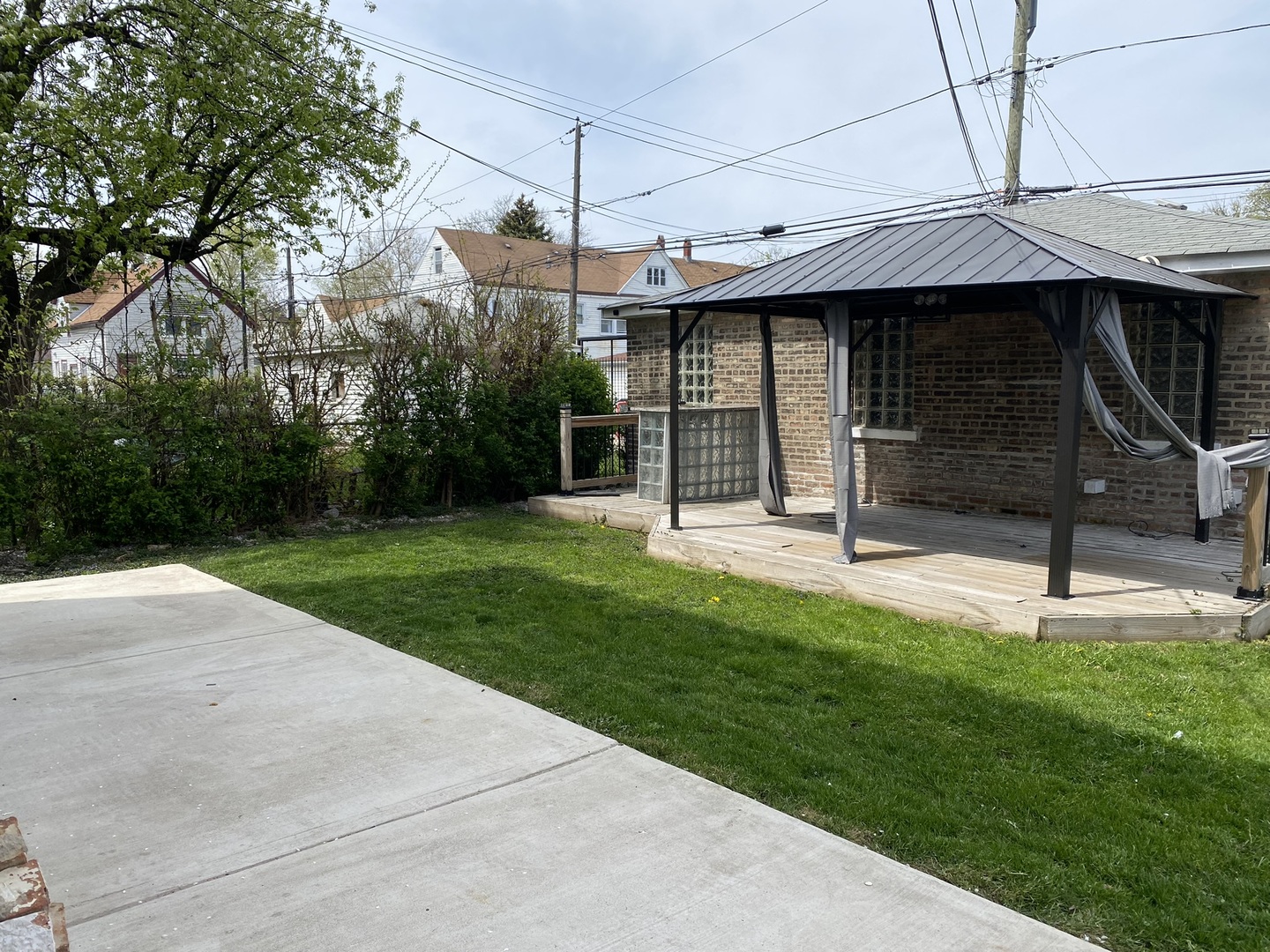 4352 West Augusta Boulevard, Unit 1 Chicago, IL 60651 - Photo 15 of 16 a view of a house with a garden and pathway