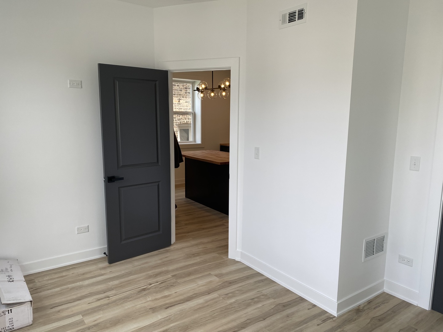 4352 West Augusta Boulevard, Unit 1 Chicago, IL 60651 - Photo 9 of 16 a view of a hallway with wooden floor
