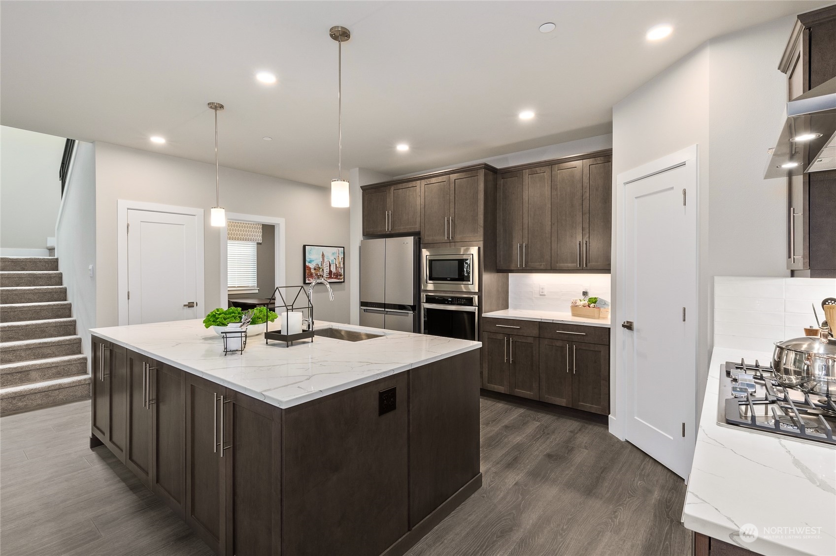 27 177th Street Southeast Bothell, WA 98012 - Photo 11 of 32 a kitchen with kitchen island a sink appliances and cabinets