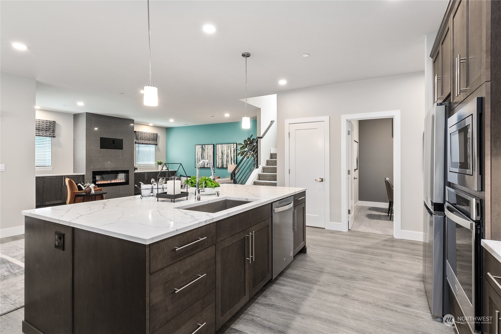 27 177th Street Southeast Bothell, WA 98012 - Photo 12 of 32 a large kitchen with a center island wooden floor and stainless steel appliances