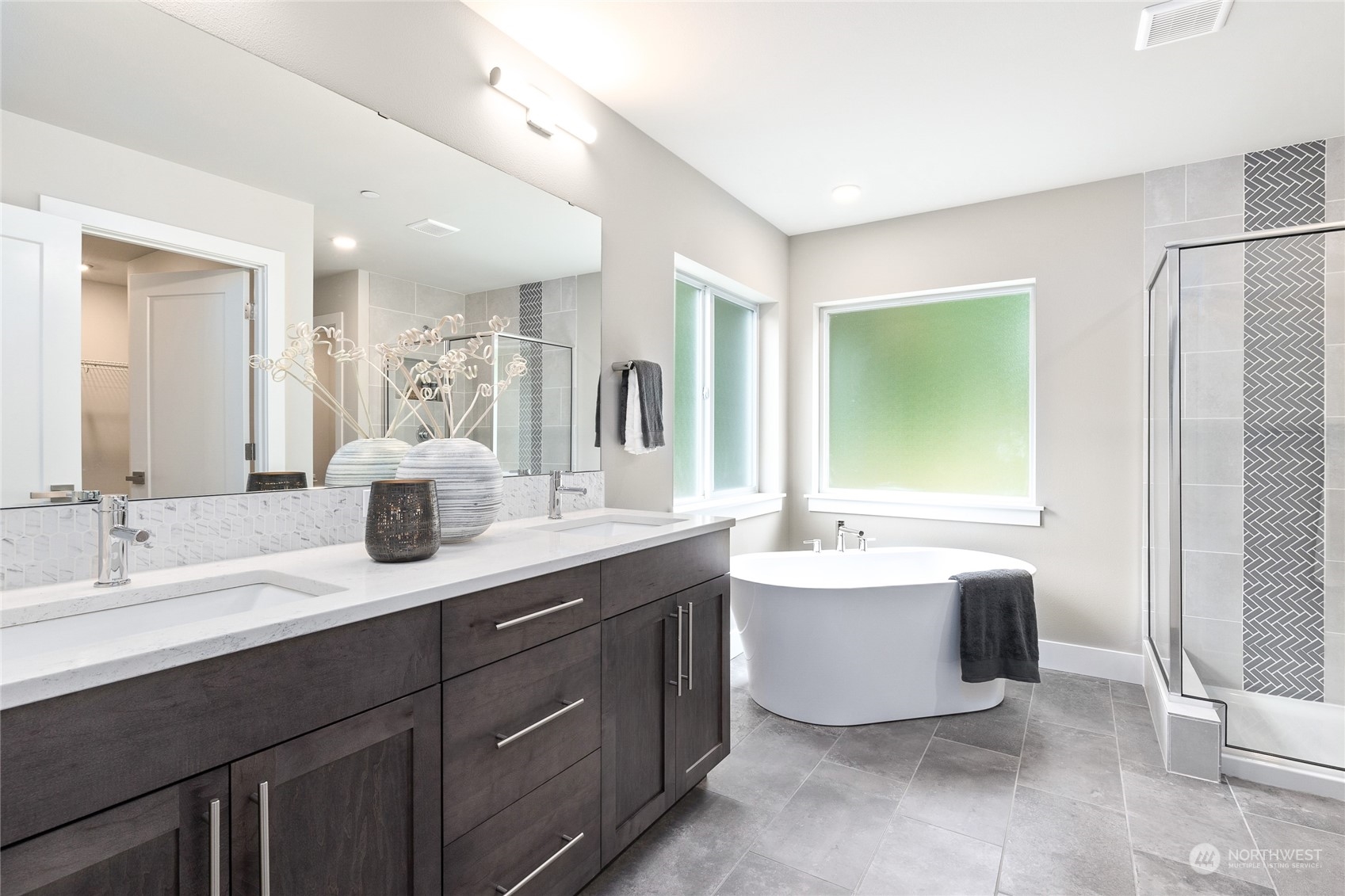 27 177th Street Southeast Bothell, WA 98012 - Photo 5 of 32 a spacious bathroom with a double vanity sink mirror and bathtub