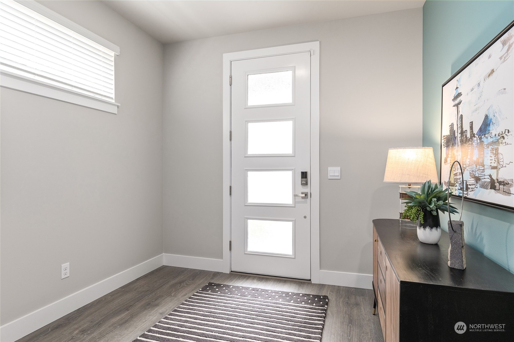 27 177th Street Southeast Bothell, WA 98012 - Photo 7 of 32 a view of an empty room with a window and wooden floor