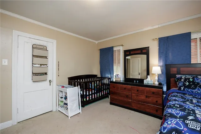 a bed room with a bed and a window