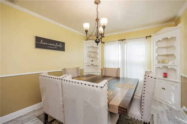 a very nice looking dining room with a table and chairs
