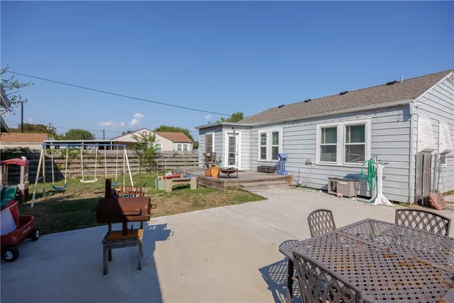 a view of a patio with swimming pool table and chairs