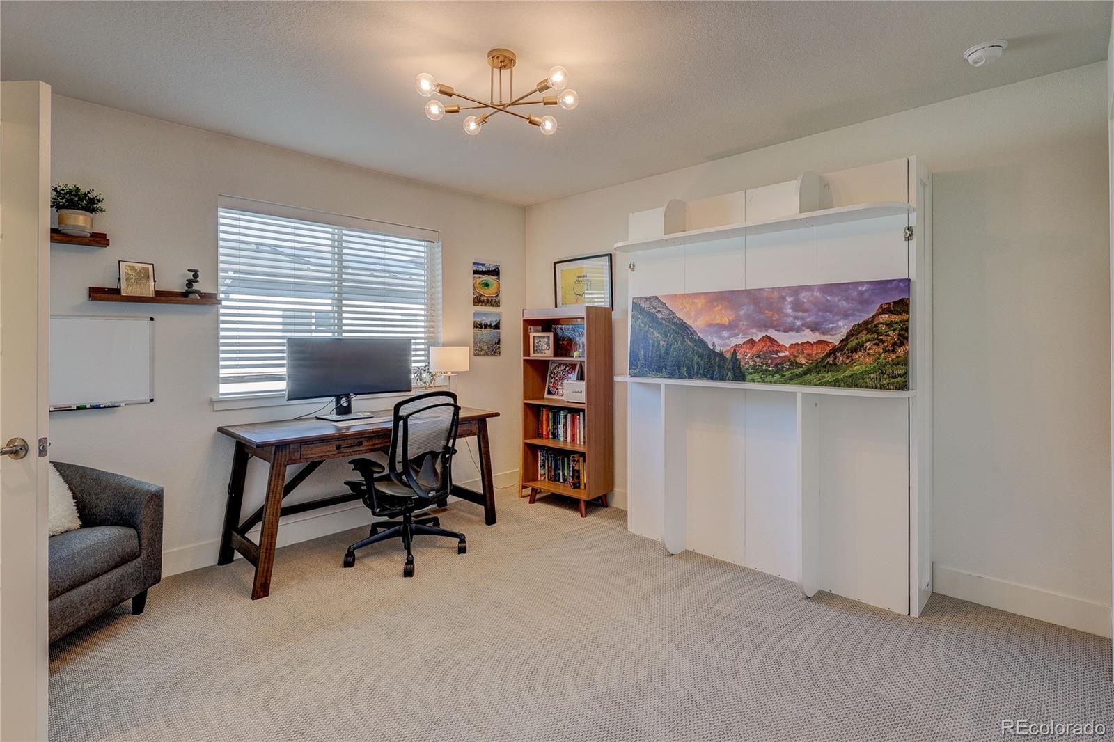 7825 West 42nd Avenue Wheat Ridge, CO 80033 - Photo 24 of 35 a view of a livingroom with workspace and a couch
