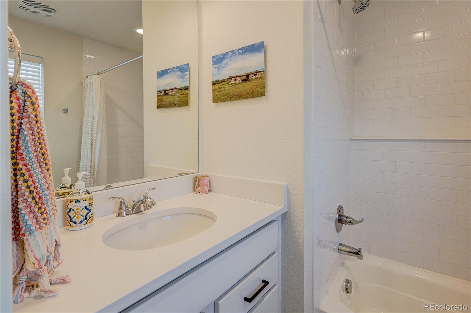 7825 West 42nd Avenue Wheat Ridge, CO 80033 - Photo 25 of 35 a bathroom with a sink and a bathtub