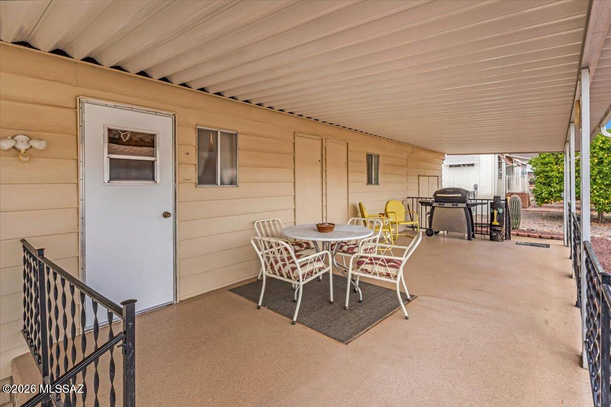 5840 West Flying W Street Tucson, AZ 85713 - Photo 30 of 38 a dining room with furniture and outdoor view