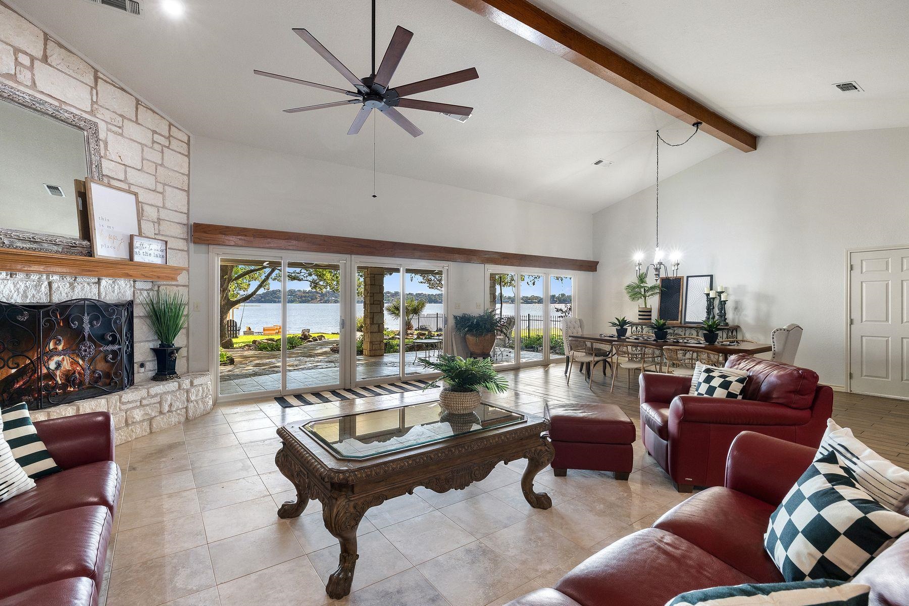 14 Beaver Island Road Granite Shoals, TX 78654 - Photo 16 of 30 a living room with furniture a fireplace and a large window