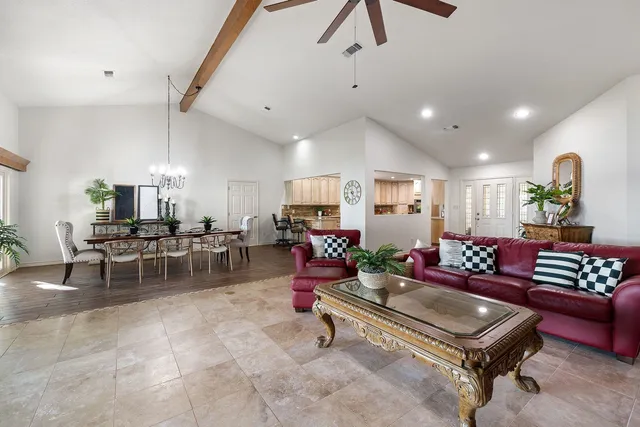 a kitchen with stainless steel appliances granite countertop a kitchen island a stove a sink dishwasher and microwave with wooden floor