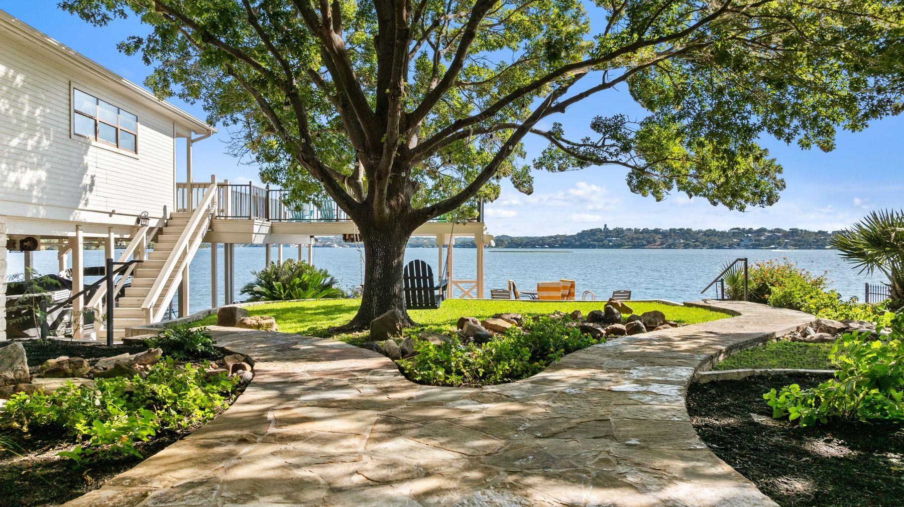 14 Beaver Island Road Granite Shoals, TX 78654 - Photo 29 of 30 a view of a garden with plants and large trees