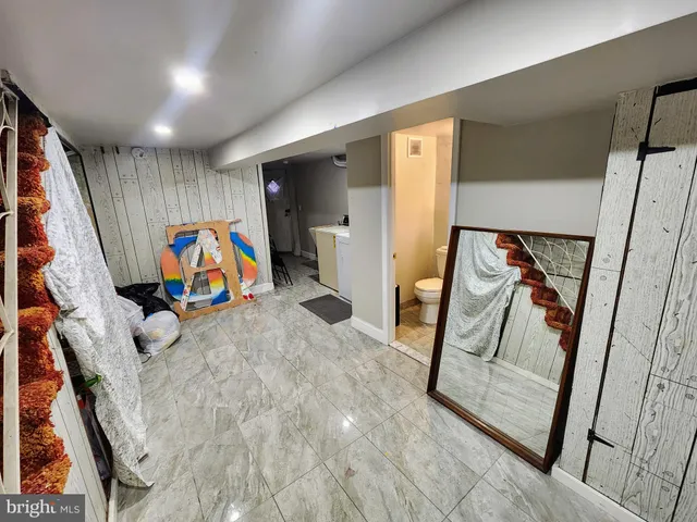 workspace with wooden floor stairs and windows