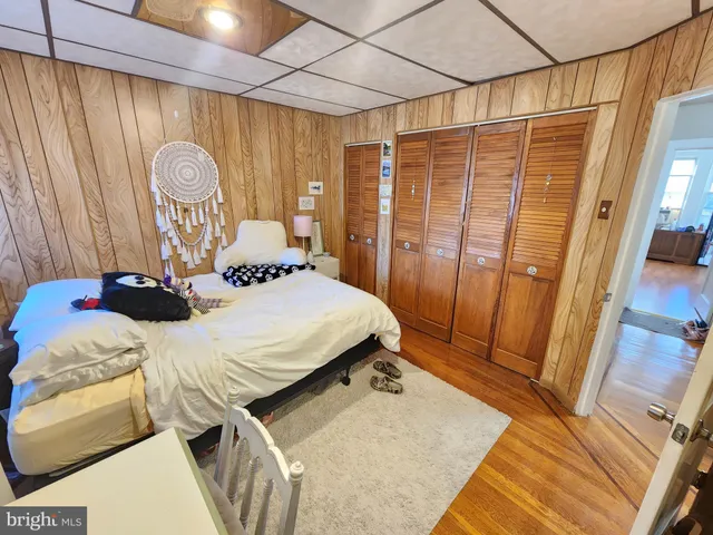 a bedroom with a bed and a table