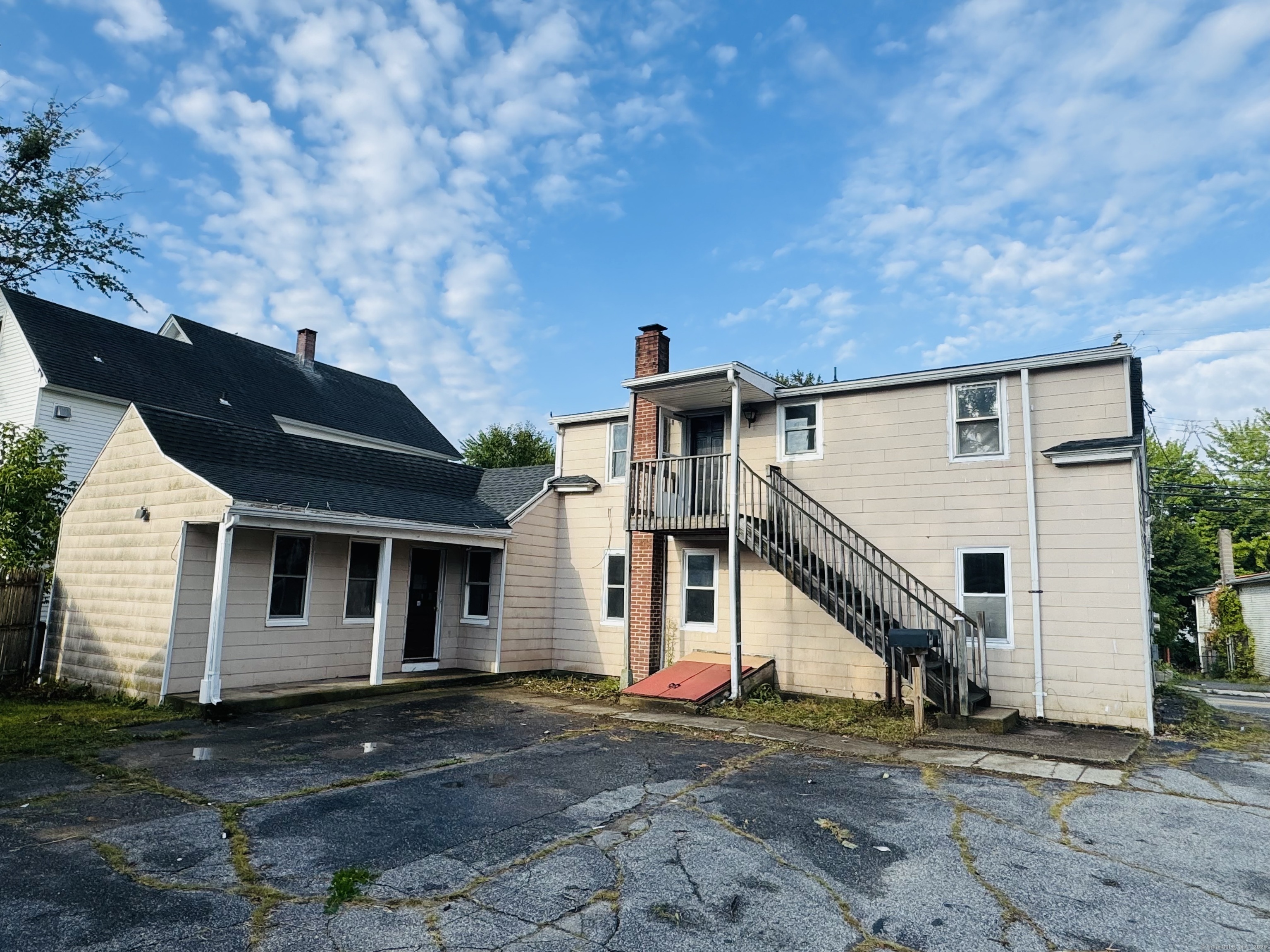a view of a house with a street