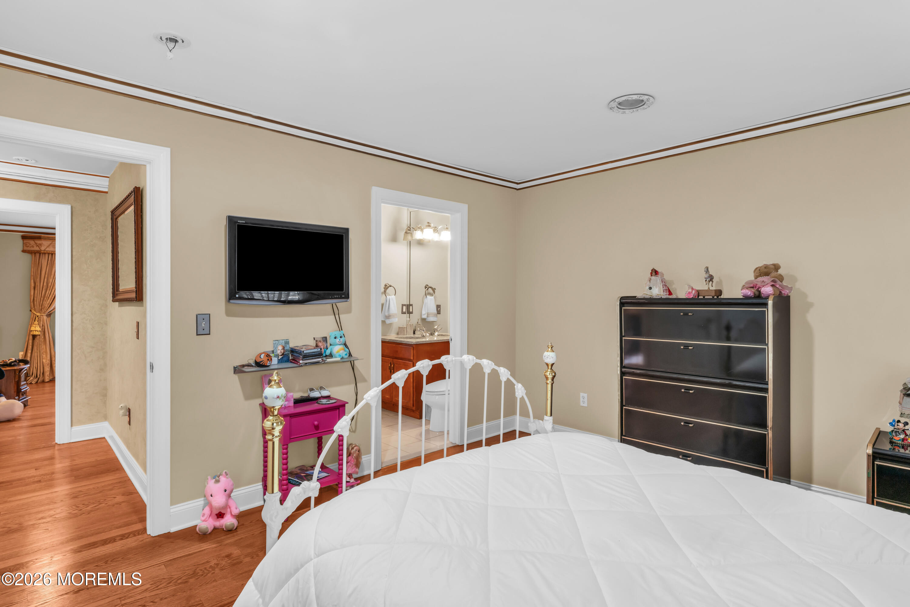 60 Yellow Meetinghouse Road Cream Ridge, NJ 08514 - Photo 34 of 59 a bedroom with a bed and a flat tv screen on the dresser