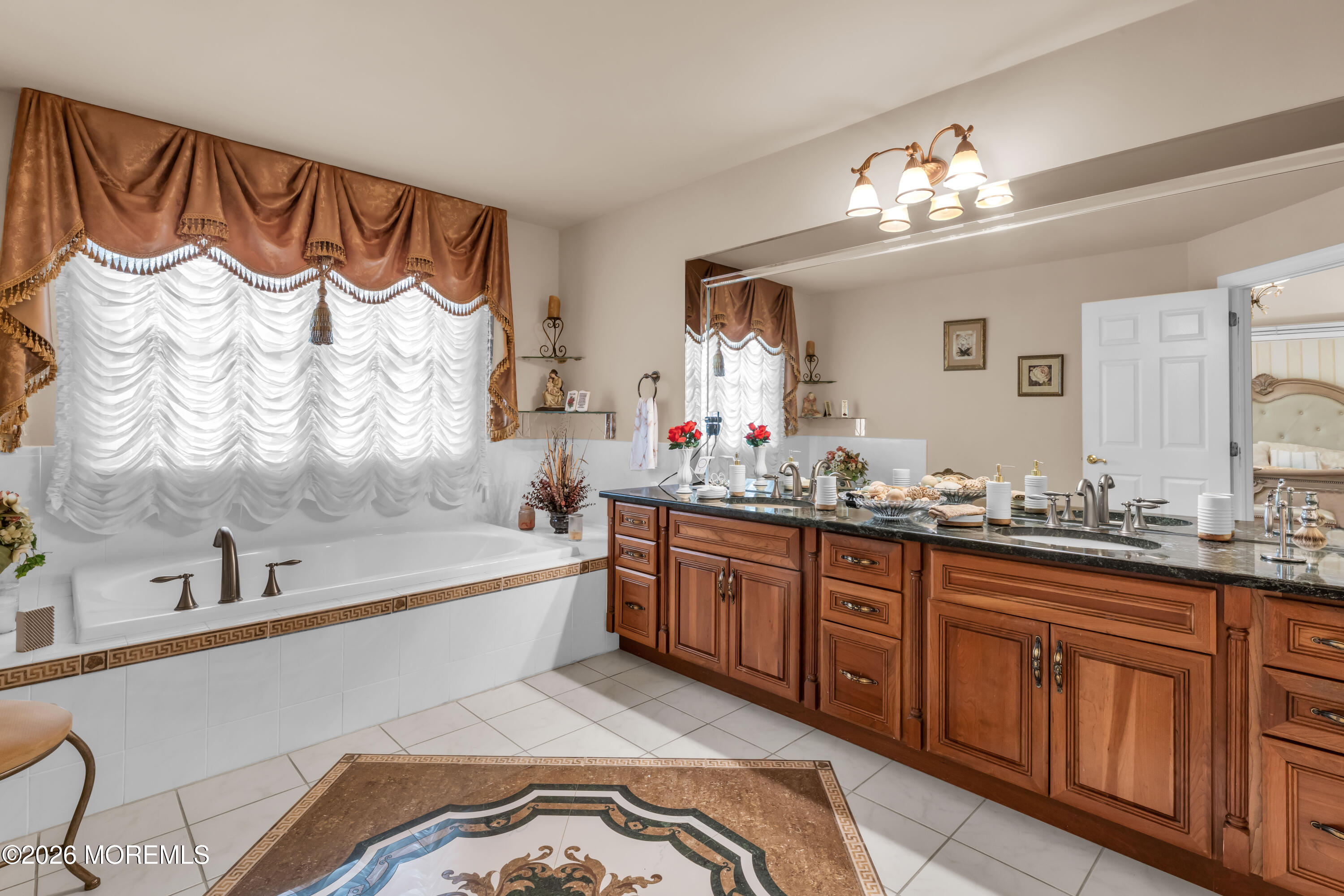 60 Yellow Meetinghouse Road Cream Ridge, NJ 08514 - Photo 39 of 59 a spacious bathroom with a bathtub sink and mirror