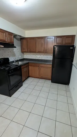 a kitchen with stainless steel appliances a sink and a microwave
