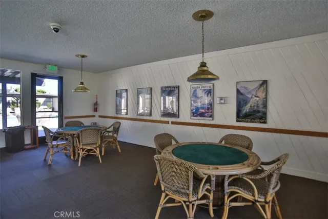 a room with lots of trees and furniture