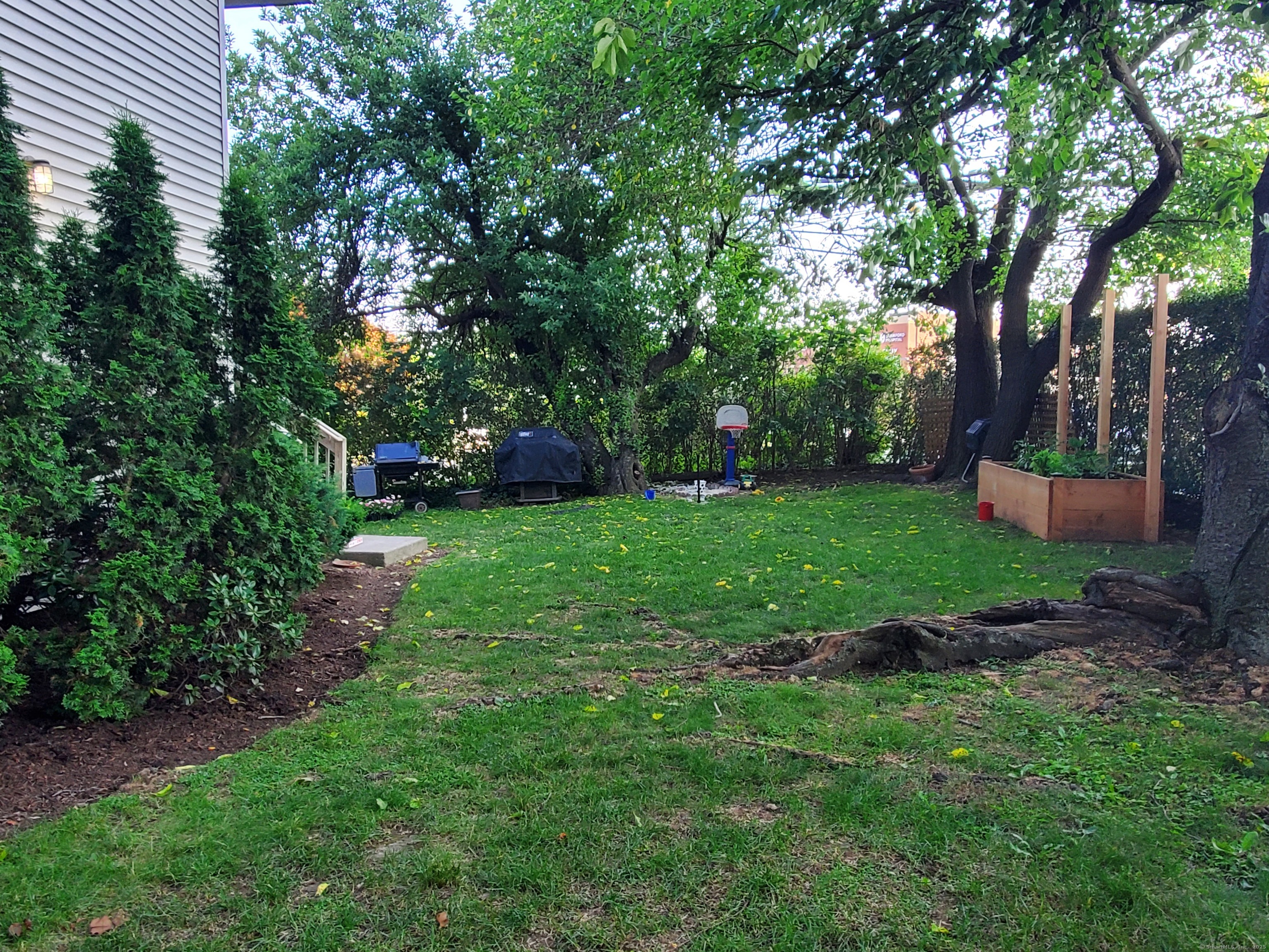 1 Rock Spring Road Stamford, CT 06906 - Photo 3 of 4 a view of a garden with a trees