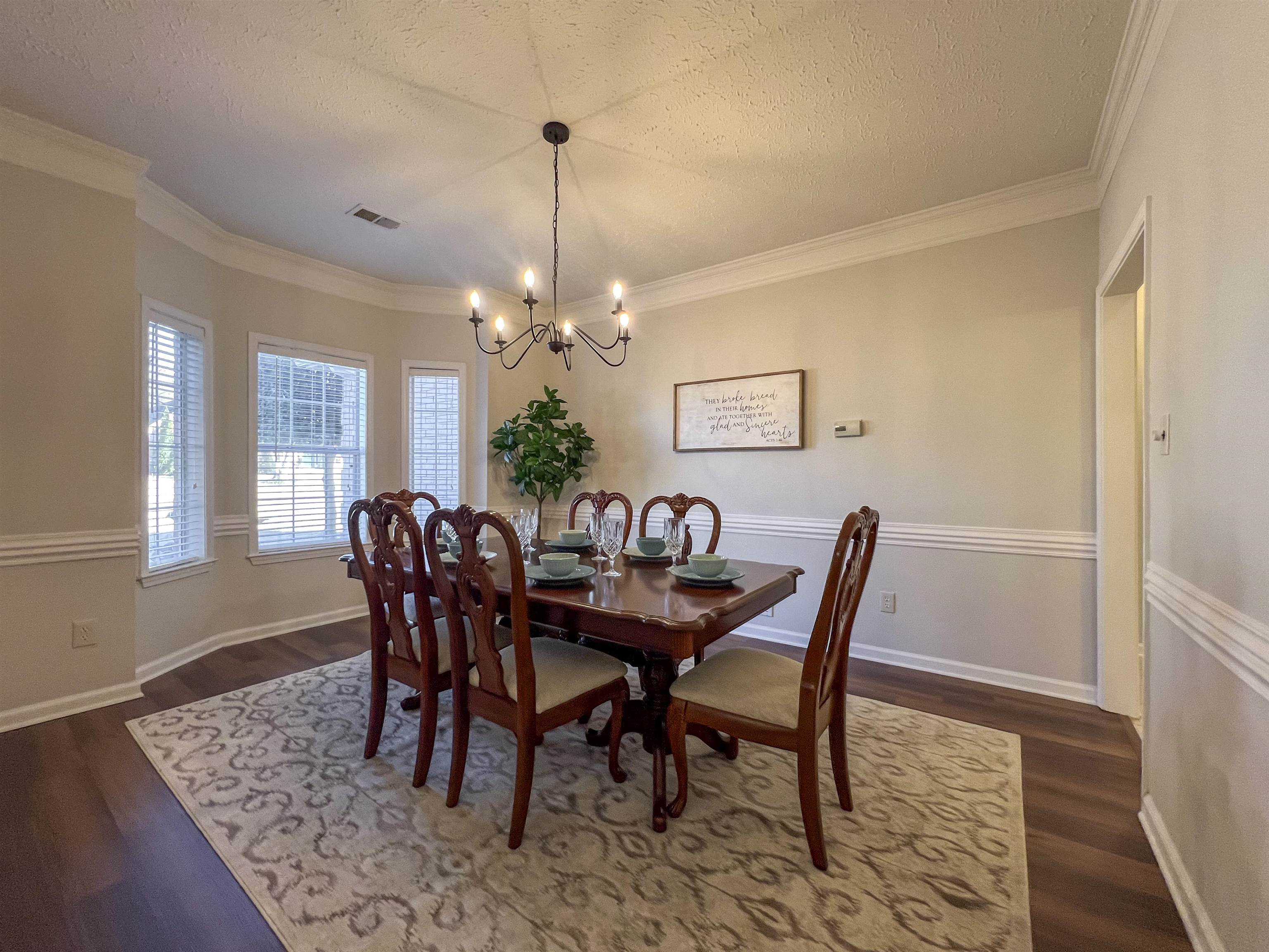503 Old Collierville-arlin Road Collierville, TN 38017 - Photo 15 of 37 a dining room with furniture a chandelier and wooden floor