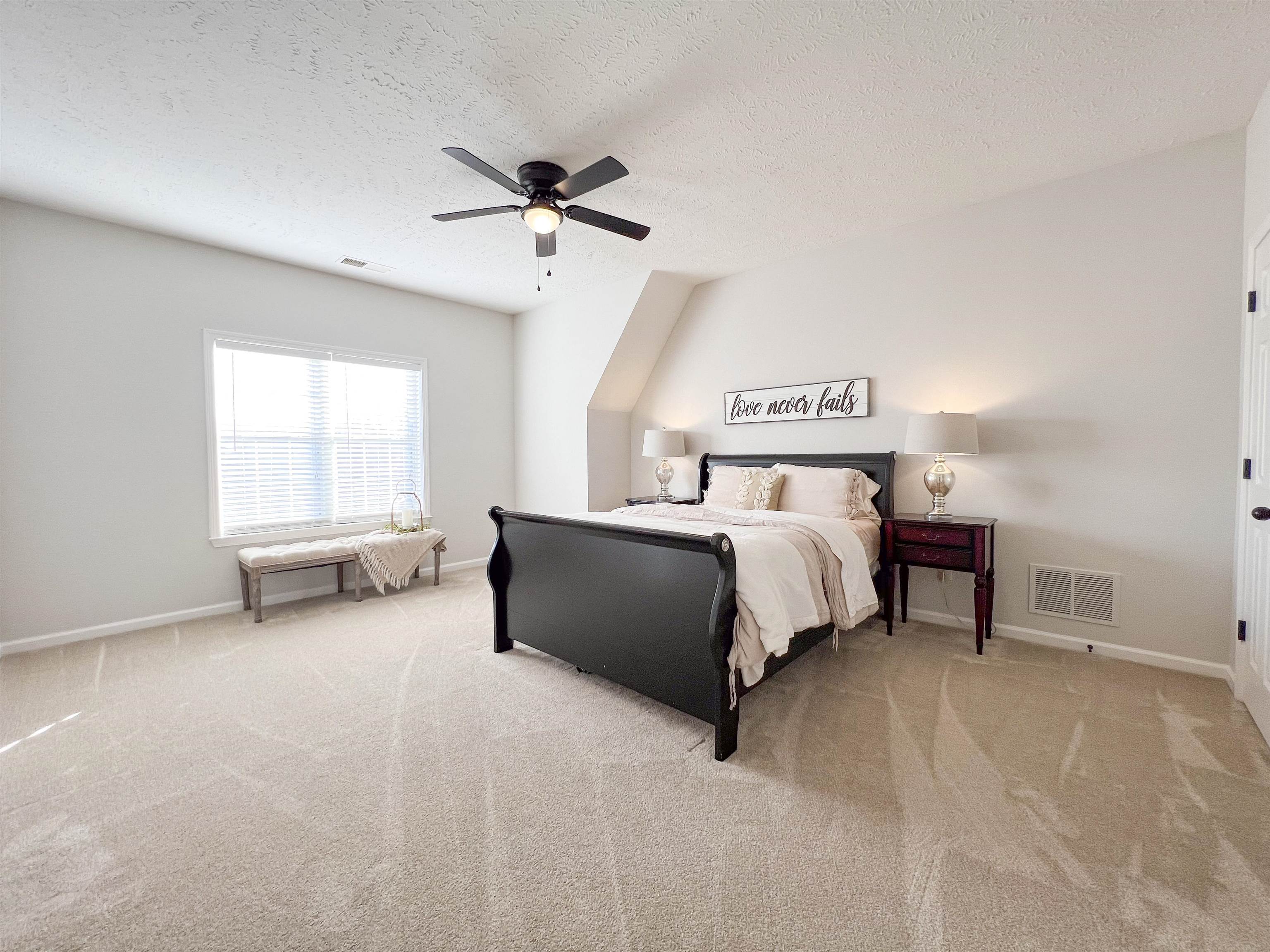 503 Old Collierville-arlin Road Collierville, TN 38017 - Photo 27 of 37 a bed sitting in a spacious bedroom next to a window