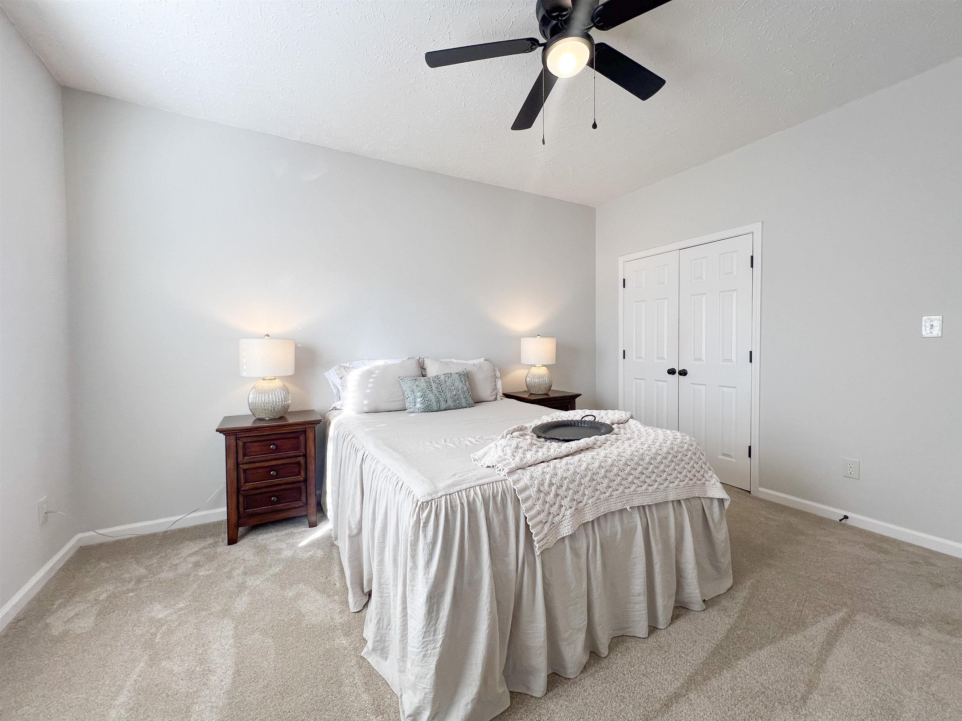 503 Old Collierville-arlin Road Collierville, TN 38017 - Photo 28 of 37 a bedroom with a bed and a chandelier