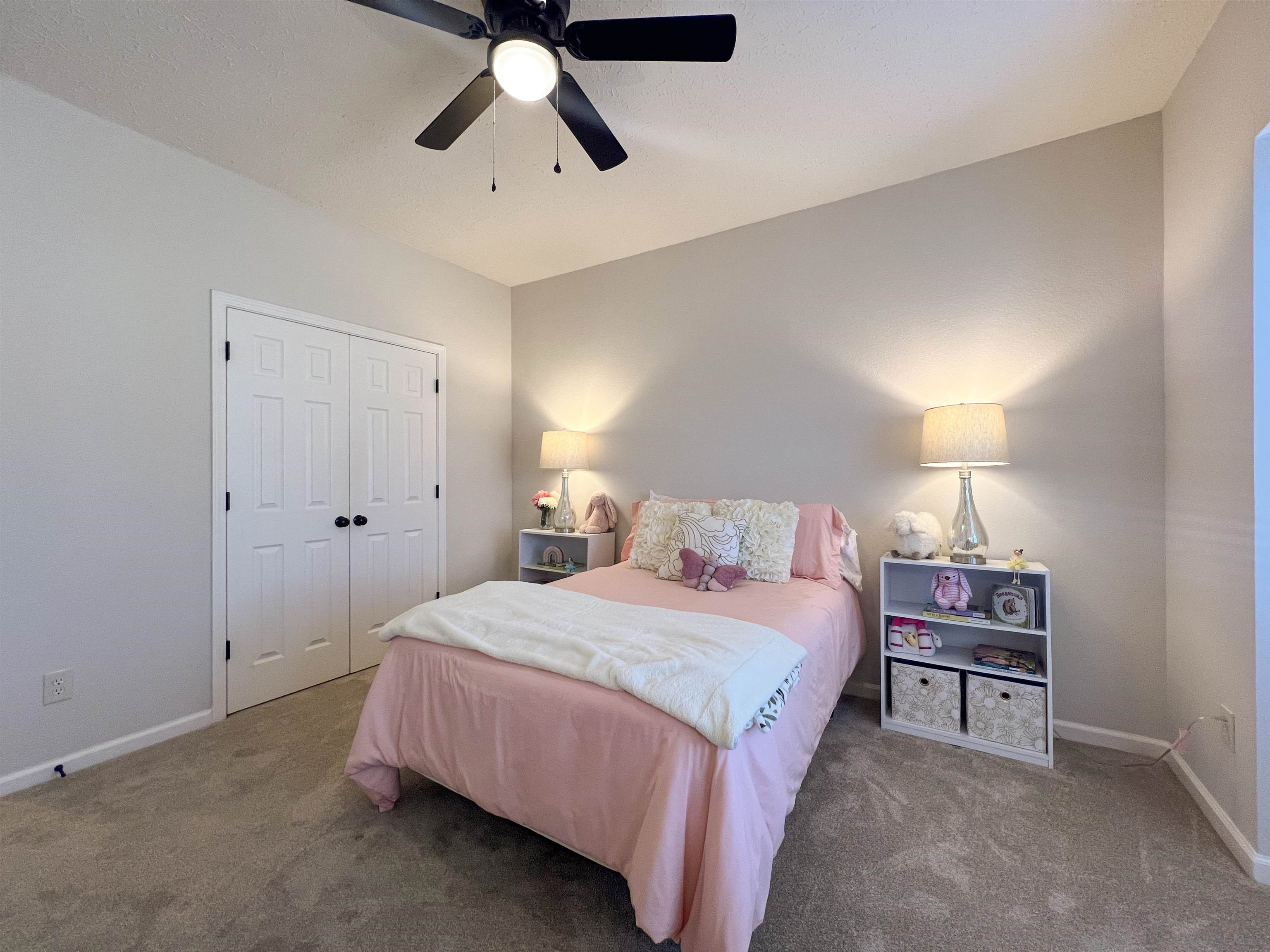 503 Old Collierville-arlin Road Collierville, TN 38017 - Photo 31 of 37 a bedroom with a bed and a chandelier