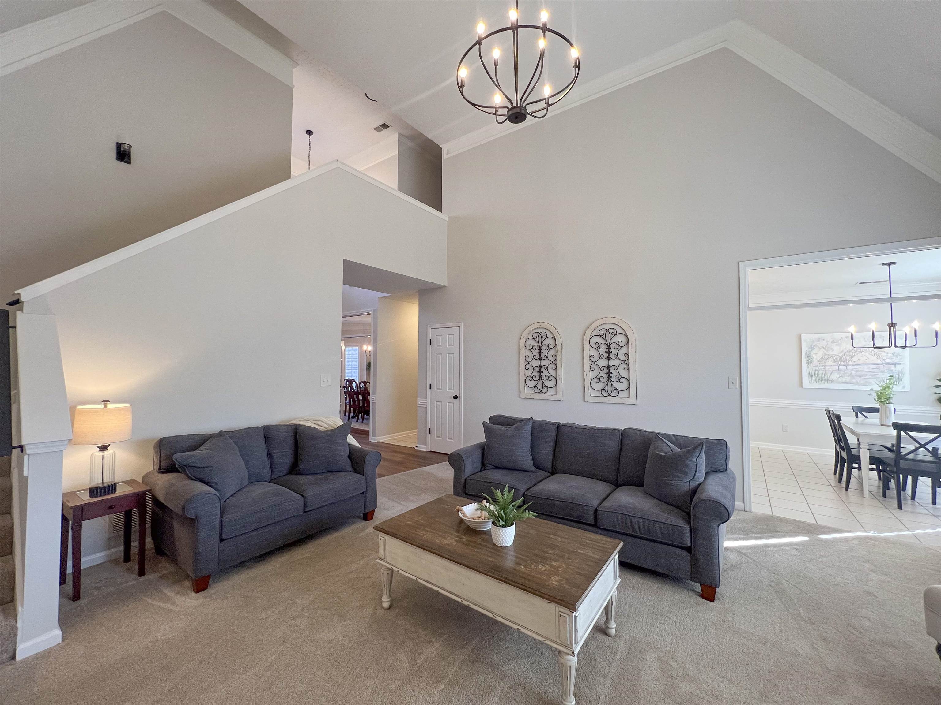 503 Old Collierville-arlin Road Collierville, TN 38017 - Photo 6 of 37 a living room with furniture a dining table and a chandelier
