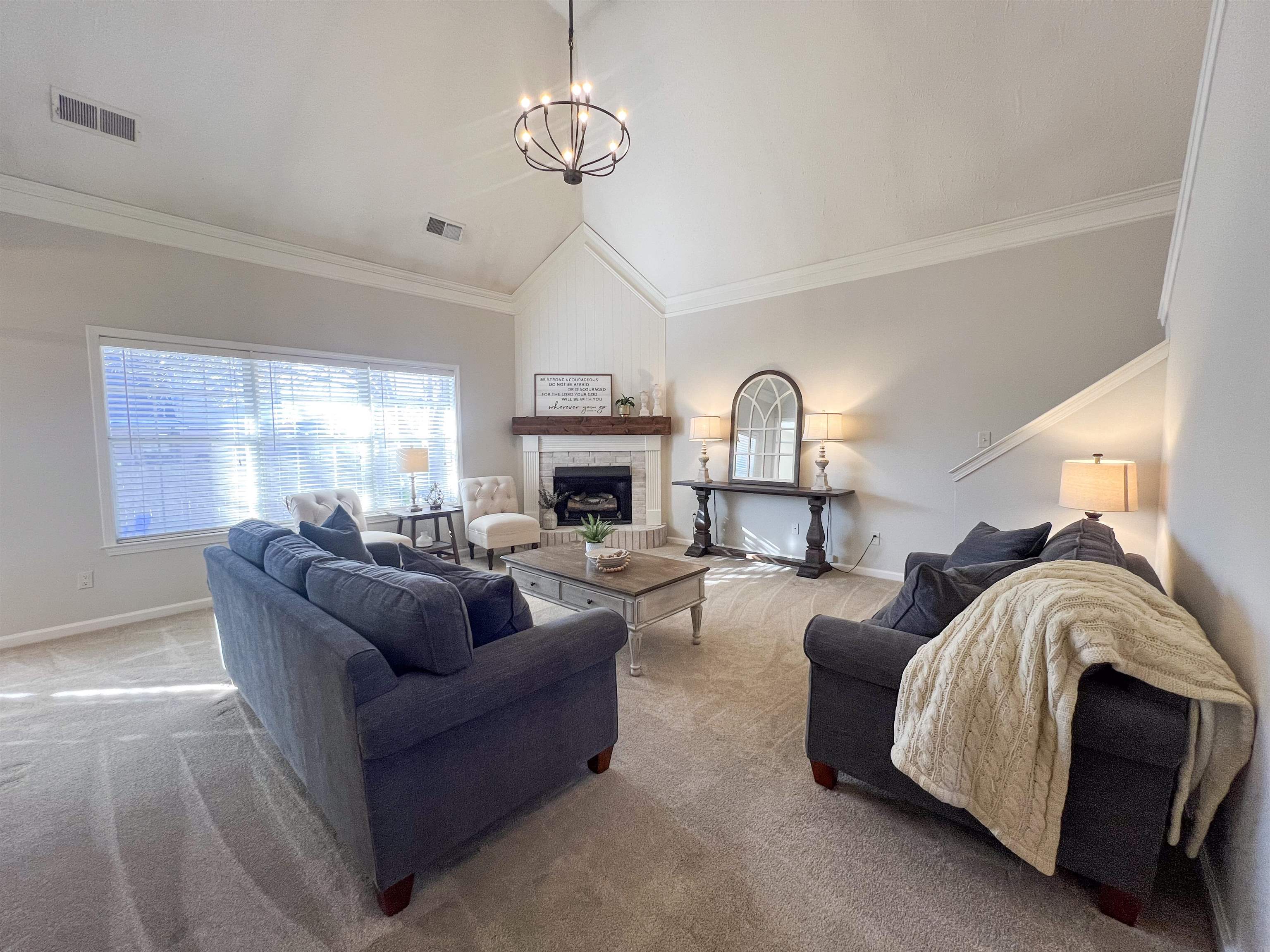 503 Old Collierville-arlin Road Collierville, TN 38017 - Photo 7 of 37 a living room with furniture a fireplace and a chandelier