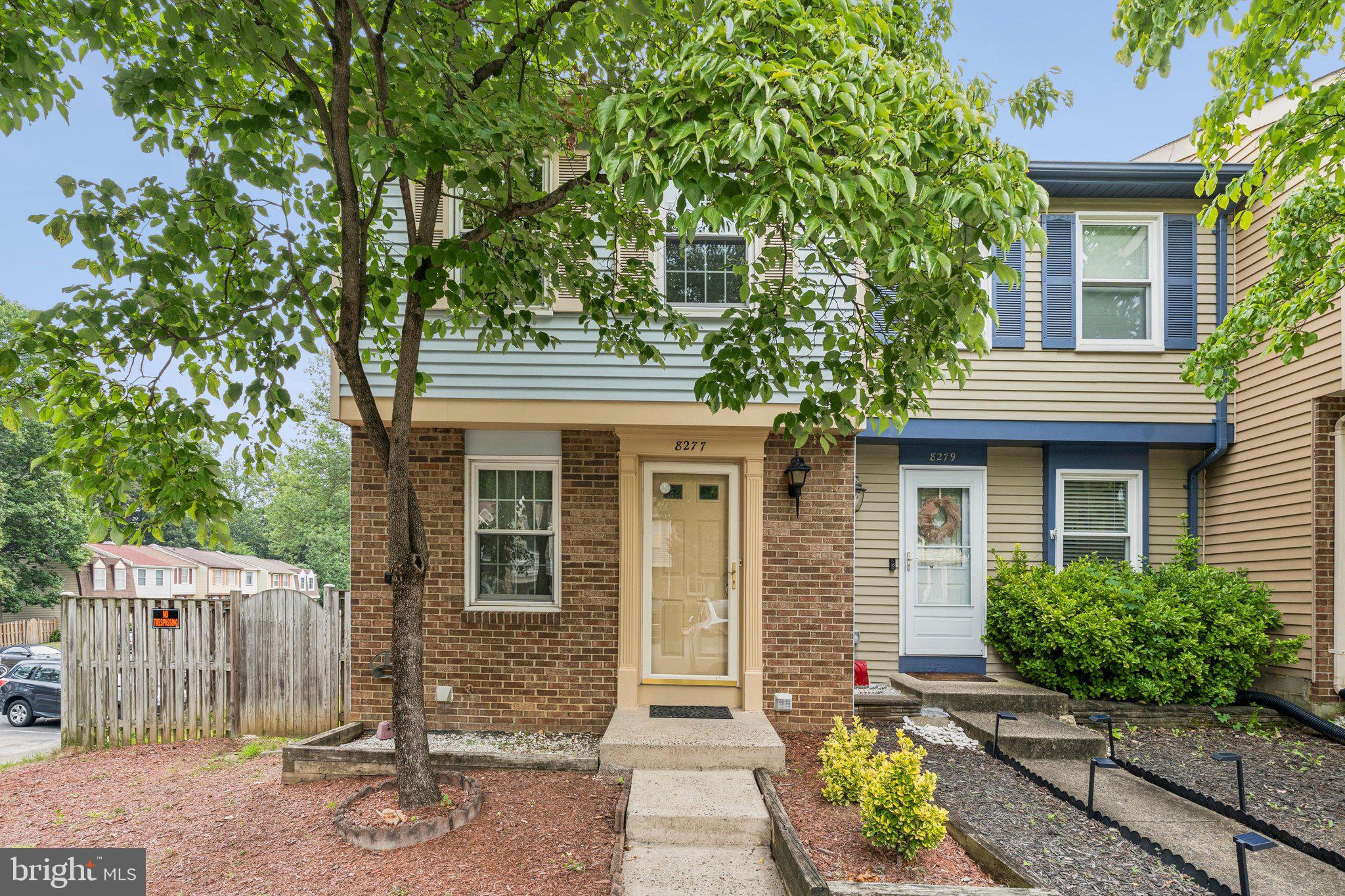 8277 Crestmont Circle Springfield, VA 22153 - Photo 1 of 23 a front view of a house with a garden