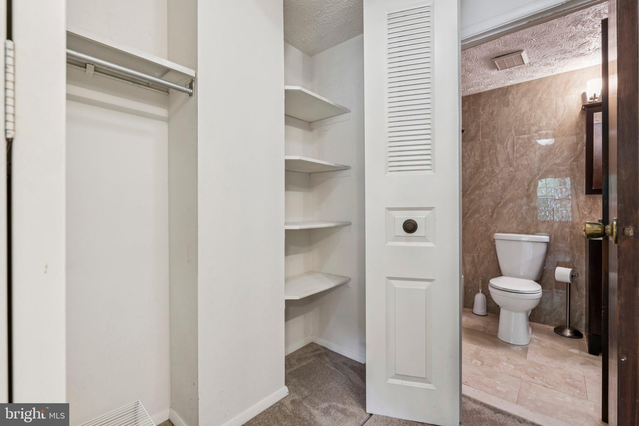 8277 Crestmont Circle Springfield, VA 22153 - Photo 14 of 23 a bathroom with a toilet and a shower