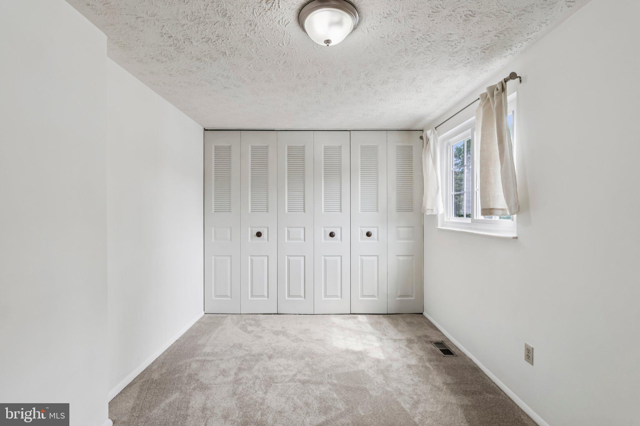 8277 Crestmont Circle Springfield, VA 22153 - Photo 15 of 23 an empty room with windows